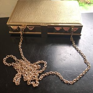MMS gold metal and leather box clutch with cross body chain. OS